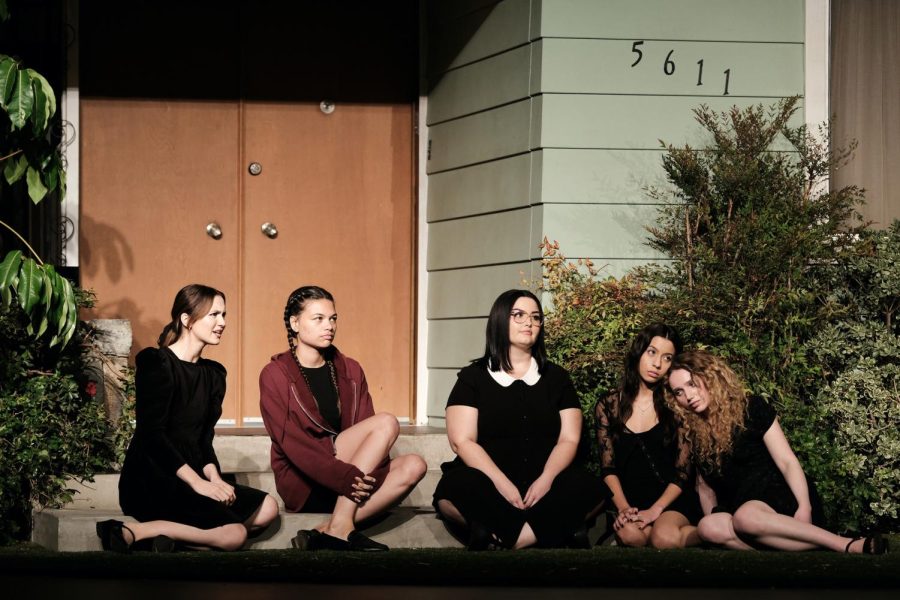 A still from season 2 of the HBO show “Euphoria” features the main cast of Lexi's school play. The five actors are seated on the steps of the stage and look ahead.