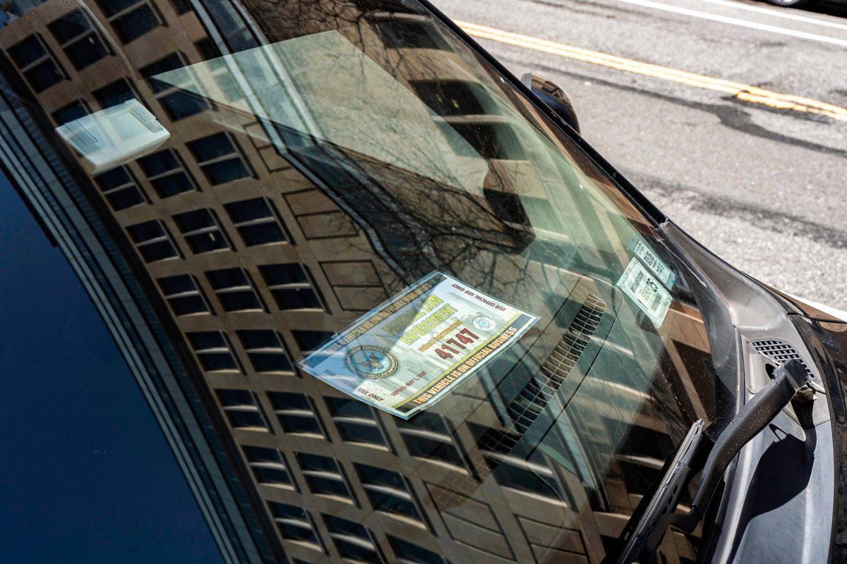 A vehicle, parked on LaGuardia Place outside Bobst Library, displaying authorization from federal law enforcement. (Alex Woodworth for WSN)